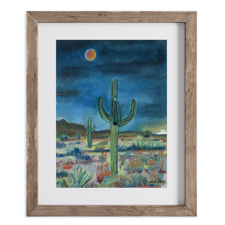 Artist Jennifer Millard painted this soft pastel right after dusk when the desert was becoming dark and a blood red moon was rising. This is a print of it in a wood frame with a white mat.