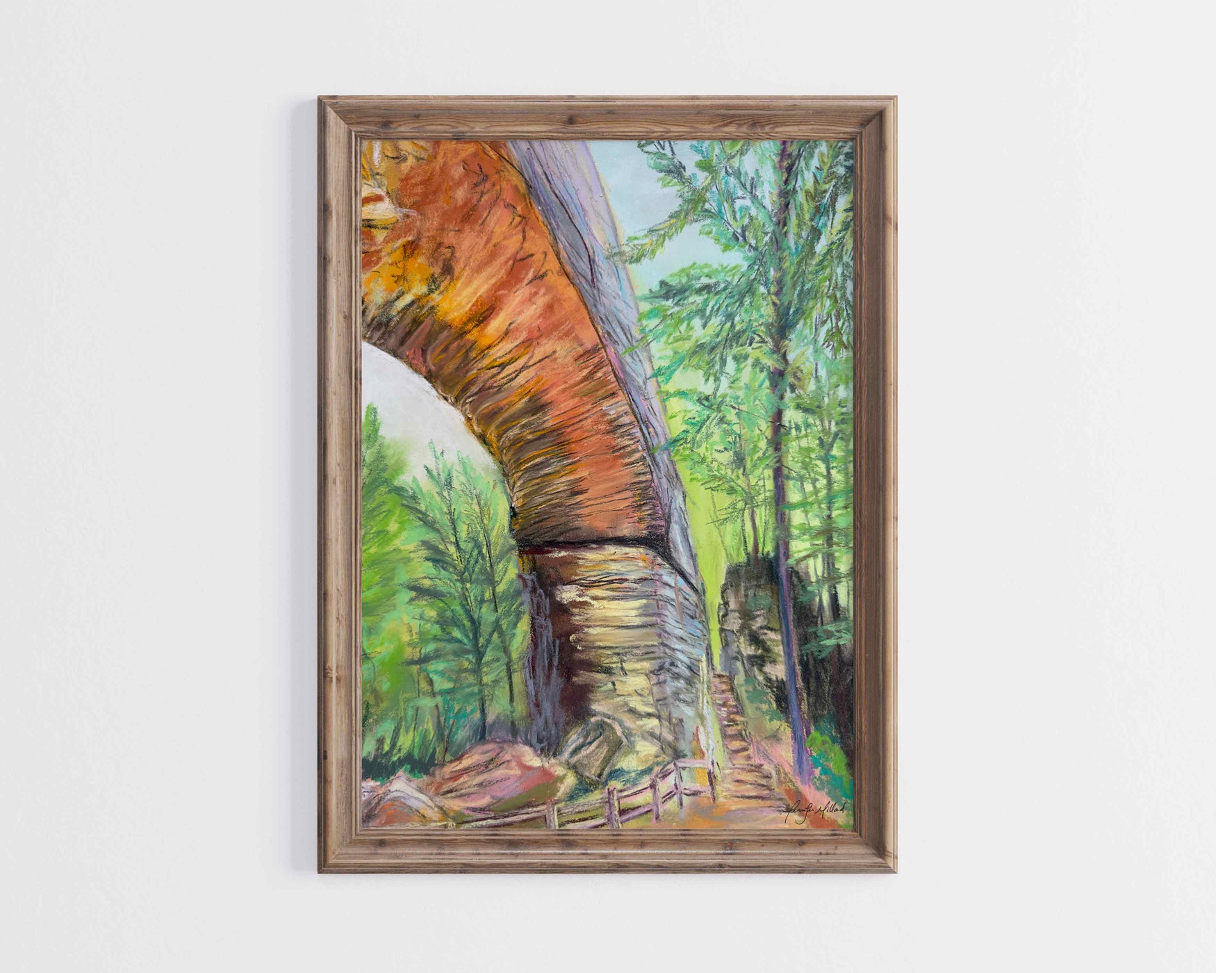 A giclee print of Natural Bridge and Fat Man's Squeeze is displayed in a light brown wood frame.