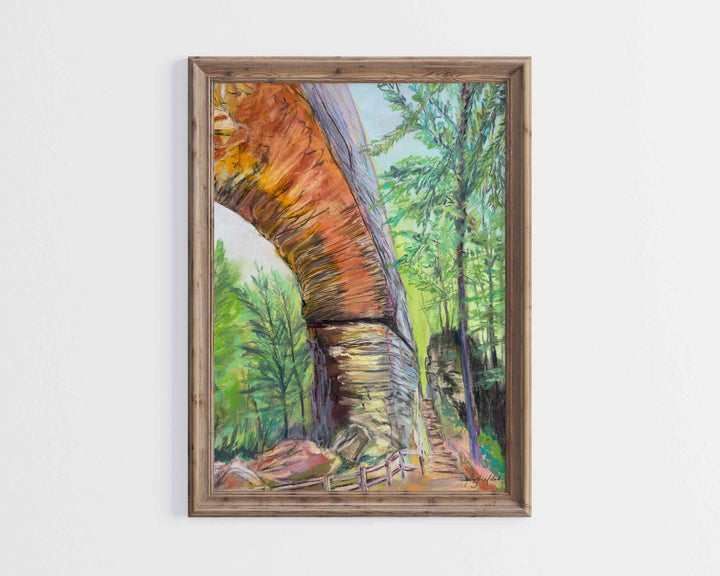 A giclee print of Natural Bridge and Fat Man's Squeeze is displayed in a light brown wood frame.