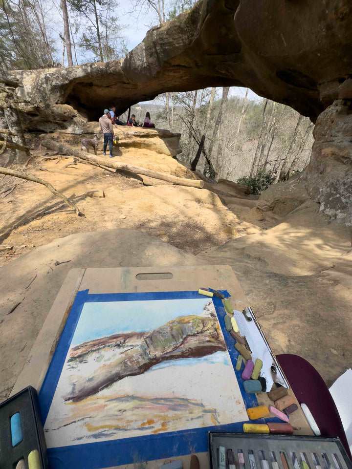 Artist Jennifer Millard works on the beginning of a painting of Princess Arch in Red River Gorge, Kentucky.