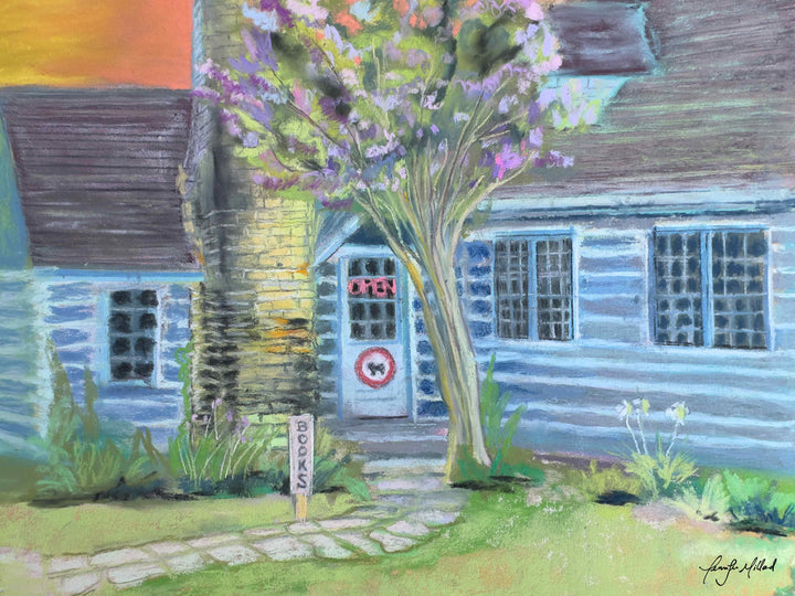 A soft pastel painting of Taleless Dog Booksellers in Berea, Kentucky. The colors are shades of green, blue and orange.
