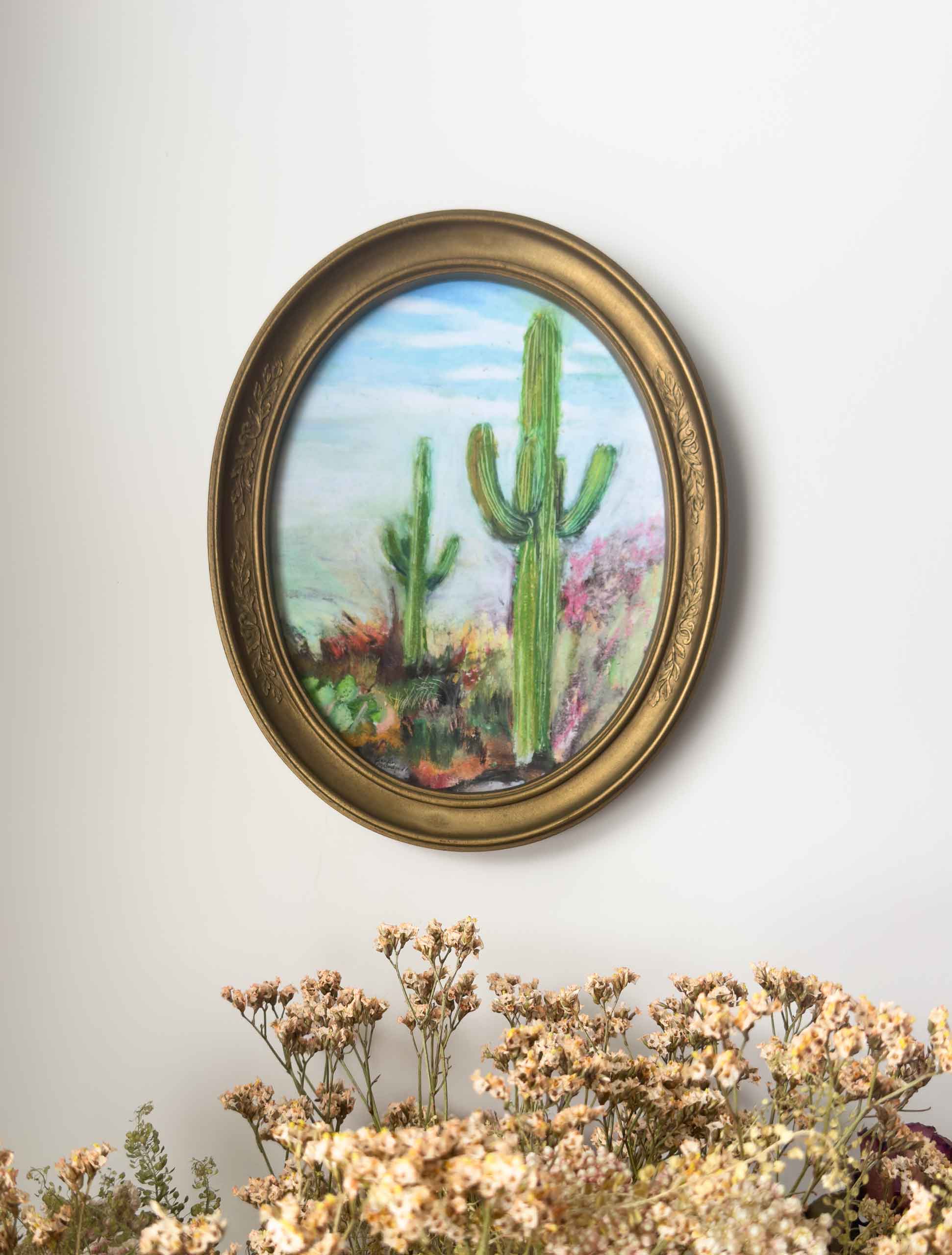 An example of what this giclee print looks like in a gold oval frame on the wall.