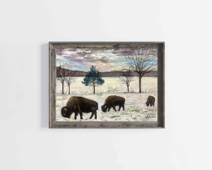 A light gray frame sits around a soft pastel of bison walking and eating in a field covered in snow.