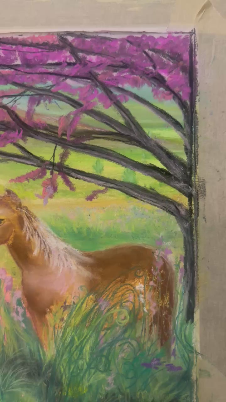 Artist Jennifer Millard adds leaves to the Red Bud tree in her soft pastel painting of horses and Red Buds.